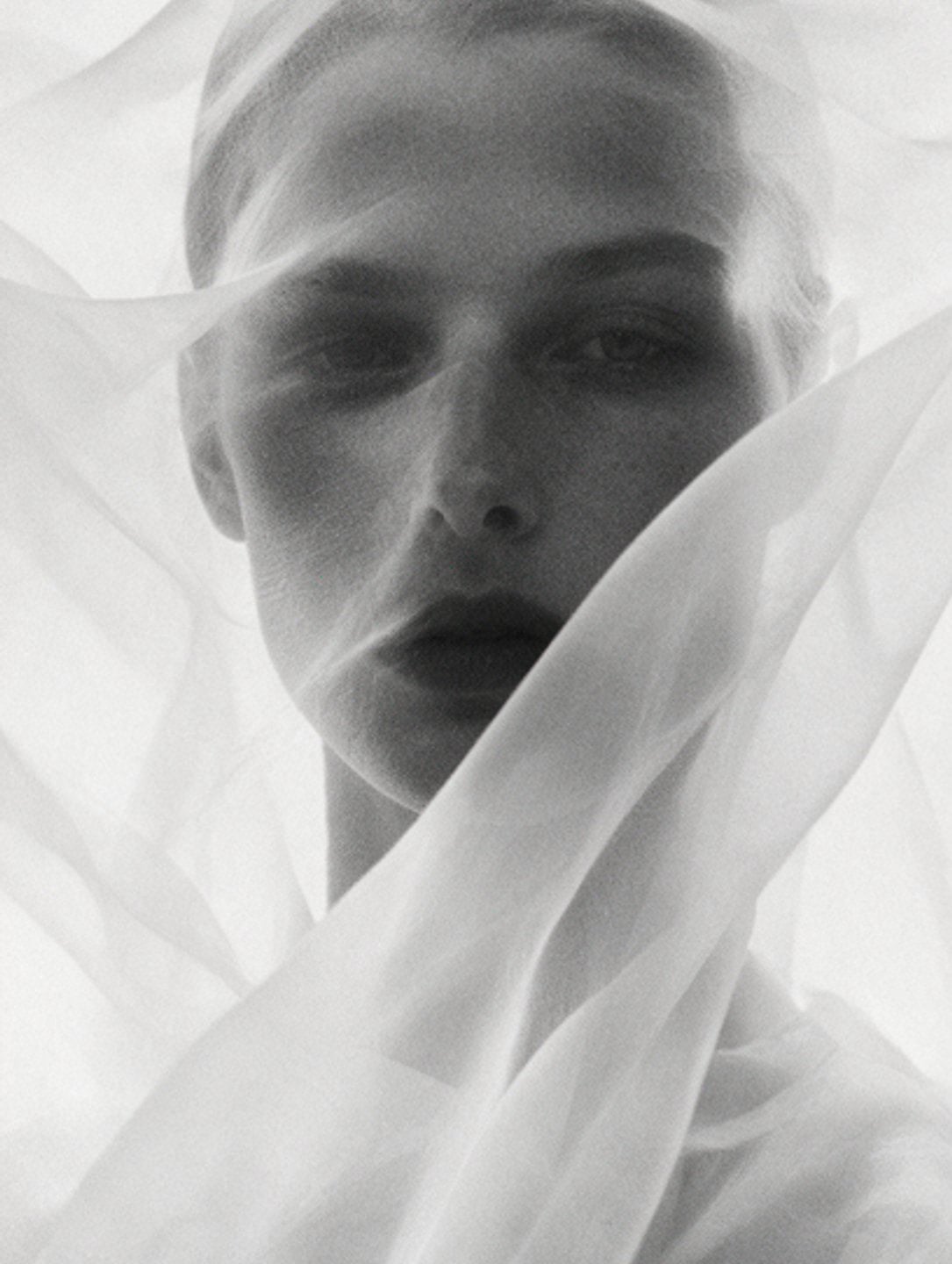 Face under a sheer veil