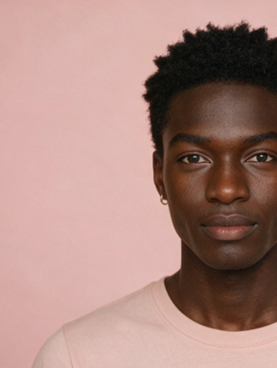 Studio portrait against a soft pink backdrop