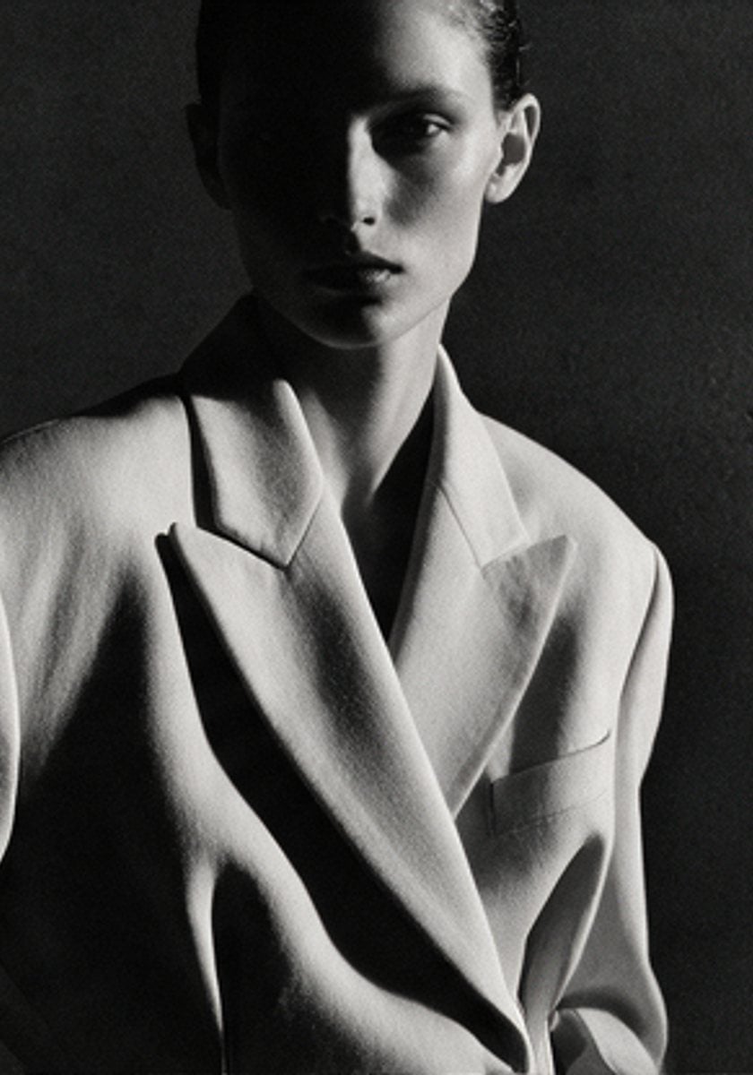 Sculptural white blazer in black and white studio light