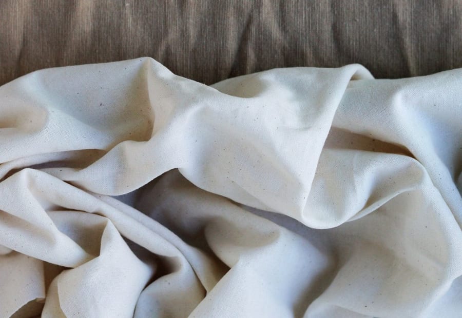 Folded white cloth in soft daylight.