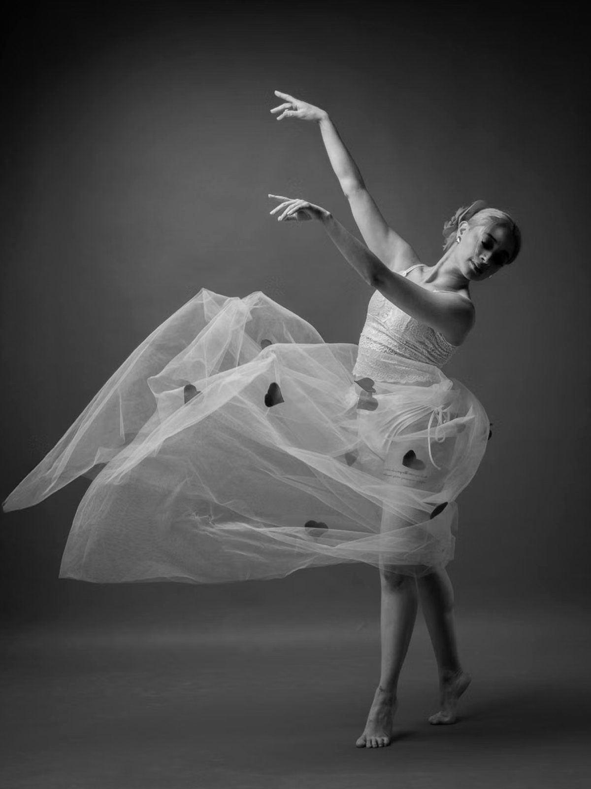 Dancer arched back in a full skirt