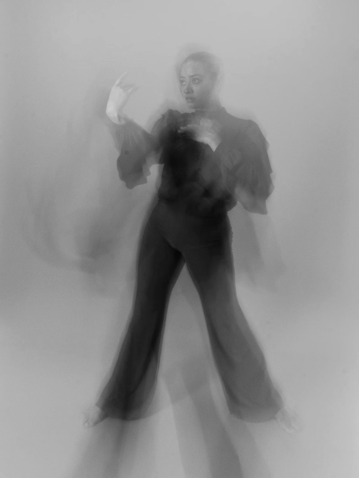 Dancer dissolving into motion blur