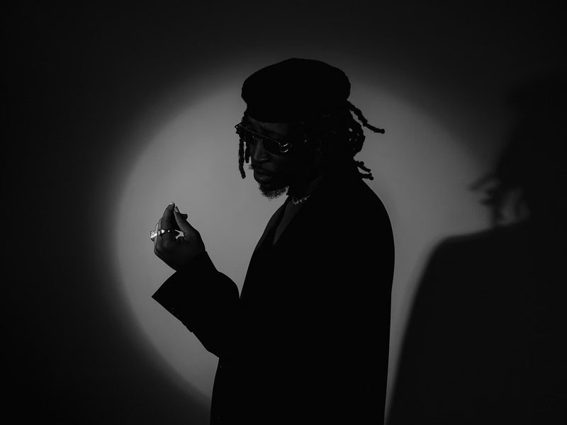 Figure and shadow under a hard spotlight