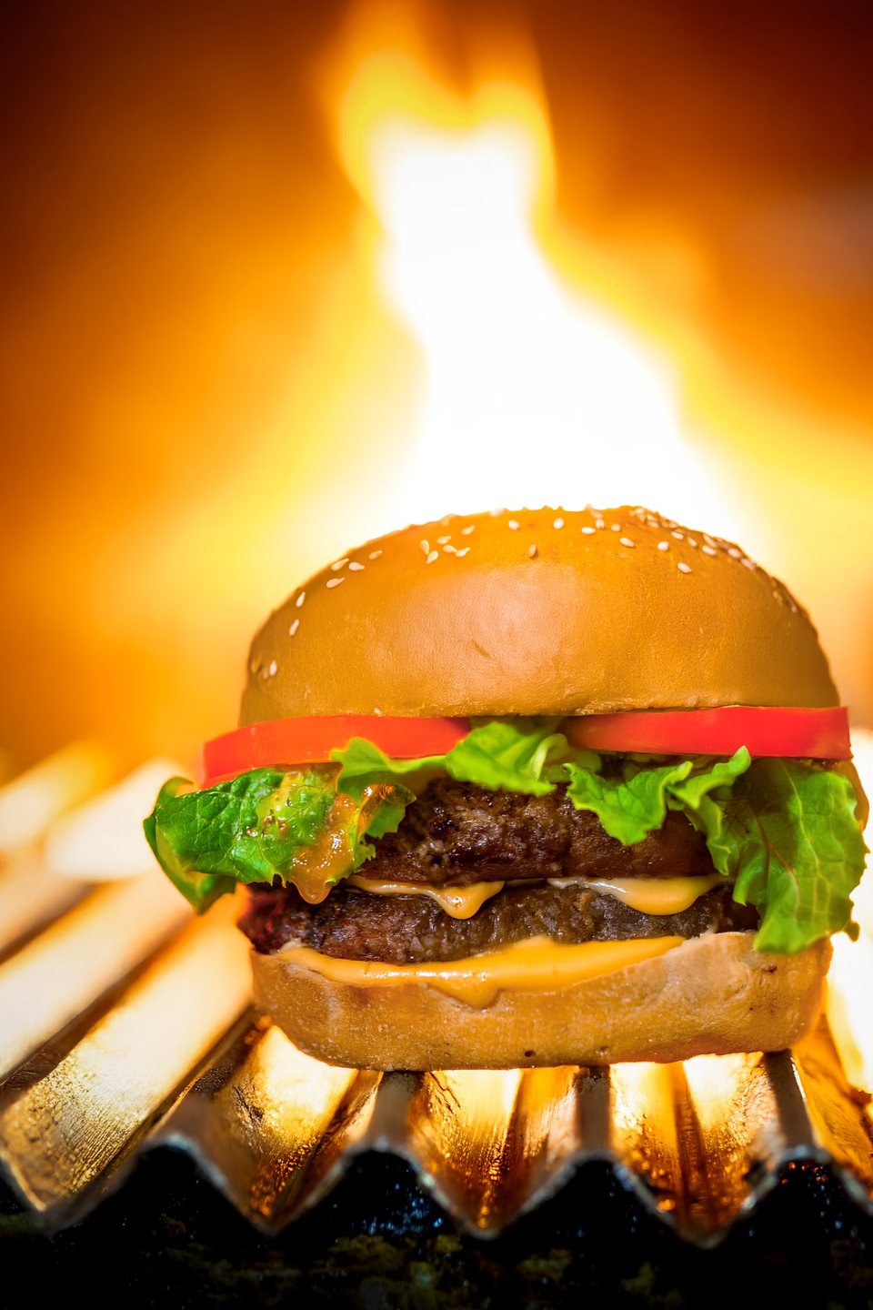 Cheeseburger seared over open flame