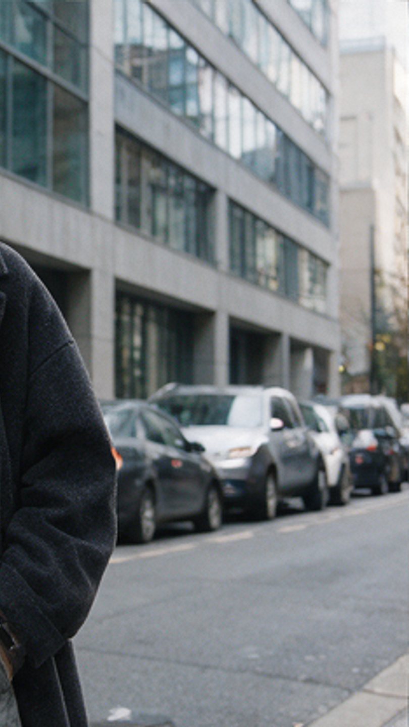 Heavy overcoat on a parked-up city street