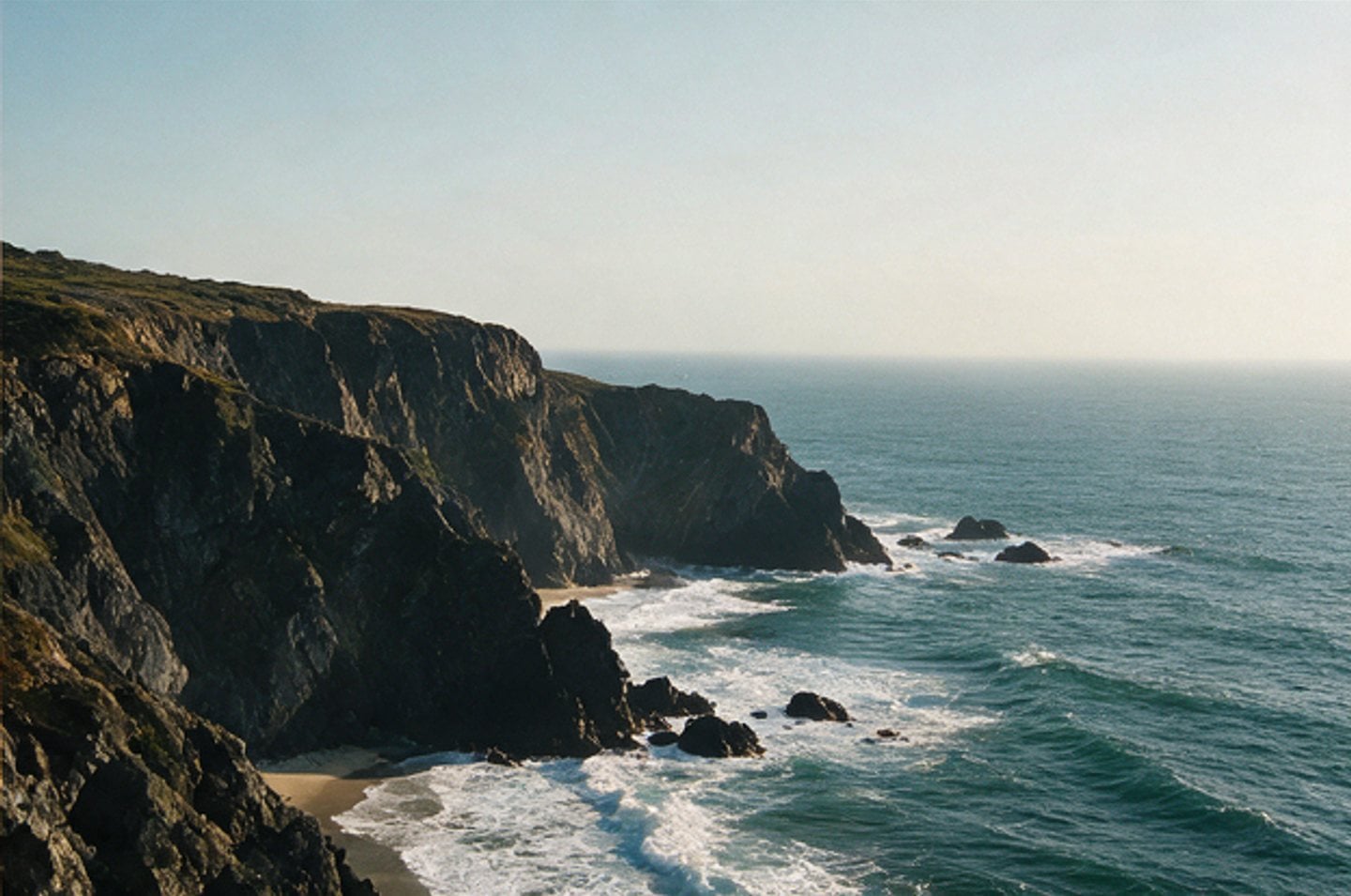 Pacific coastline breaking on rock at first light