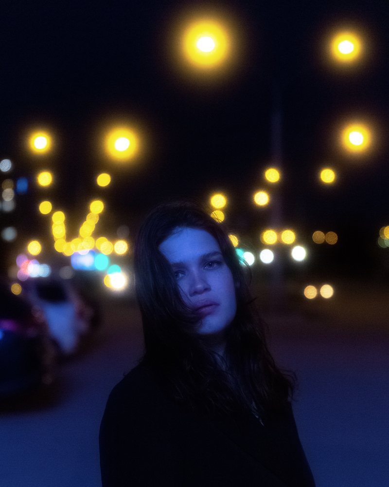 Portrait under city bokeh
